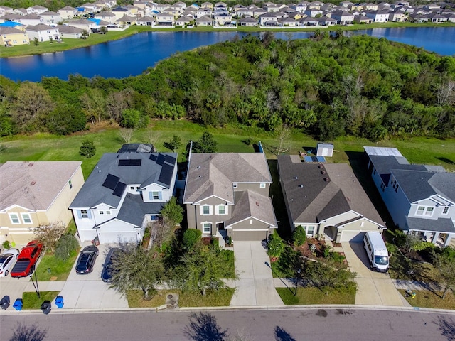 bird's eye view with a water view and a residential view