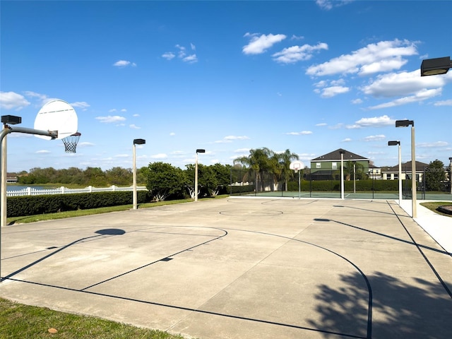 view of sport court with community basketball court and fence