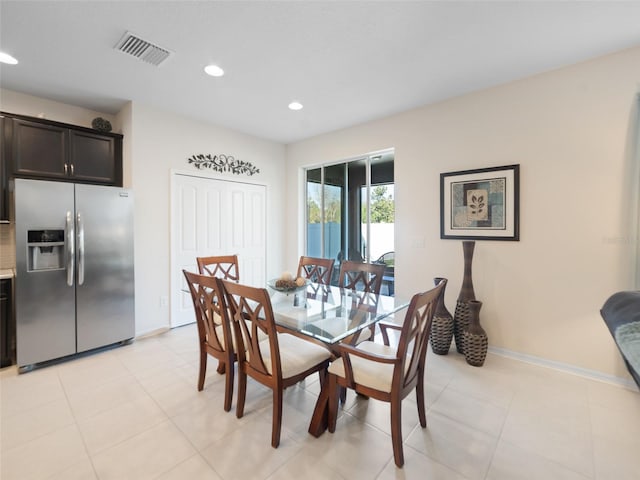 dining space with baseboards, light tile patterned flooring, visible vents, and recessed lighting