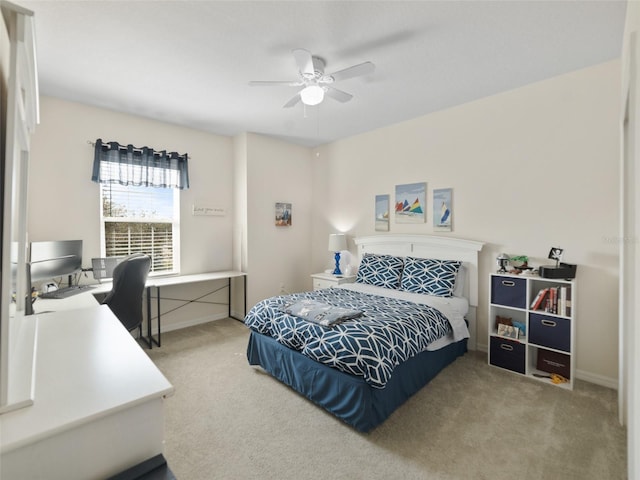 carpeted bedroom featuring ceiling fan and baseboards