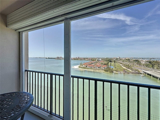 balcony featuring a water view