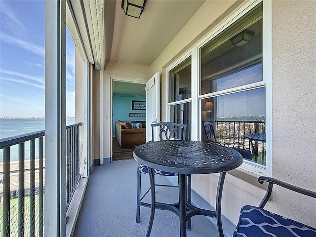 balcony featuring a water view