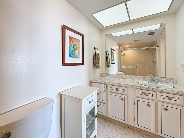 full bath featuring visible vents, a stall shower, toilet, and vanity