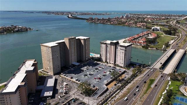 birds eye view of property with a view of city and a water view