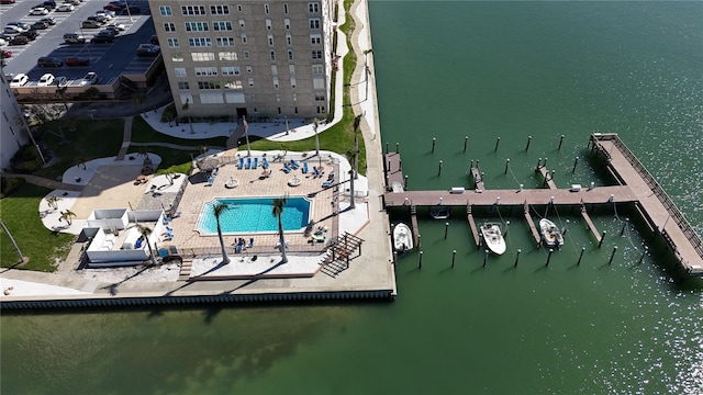 birds eye view of property with a water view