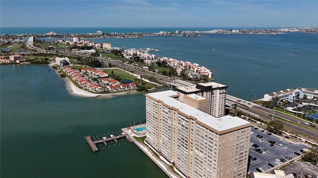 birds eye view of property featuring a water view and a city view