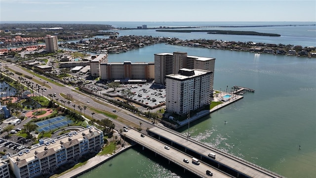 birds eye view of property with a view of city and a water view