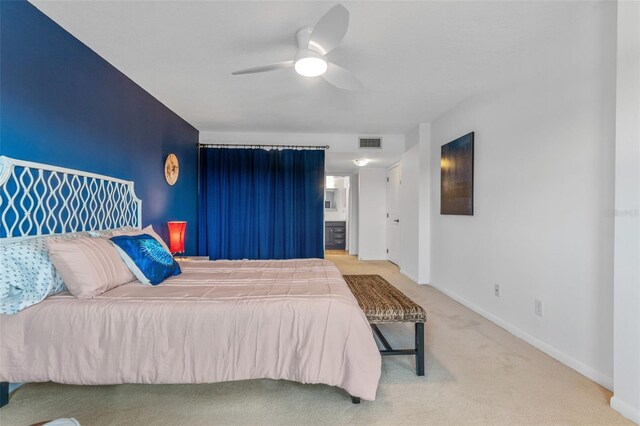 bedroom featuring carpet, visible vents, ceiling fan, and baseboards