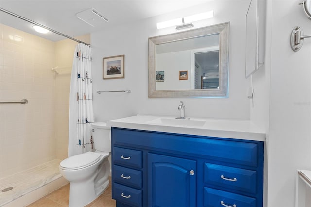 full bathroom with a tile shower, vanity, toilet, and tile patterned floors