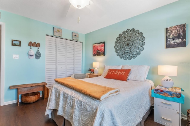 bedroom featuring a closet, wood finished floors, a ceiling fan, and baseboards