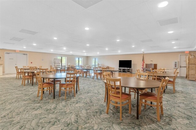 carpeted dining room with recessed lighting and visible vents