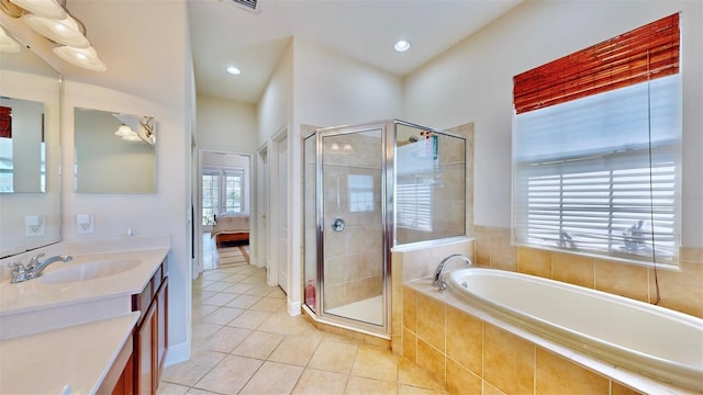 full bath featuring a garden tub, connected bathroom, a shower stall, and tile patterned floors