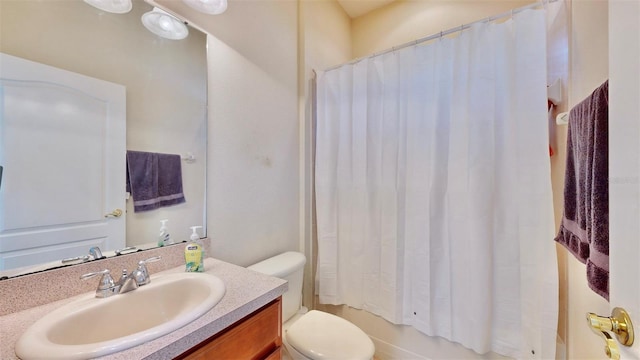 bathroom with toilet, shower / bathtub combination with curtain, and vanity