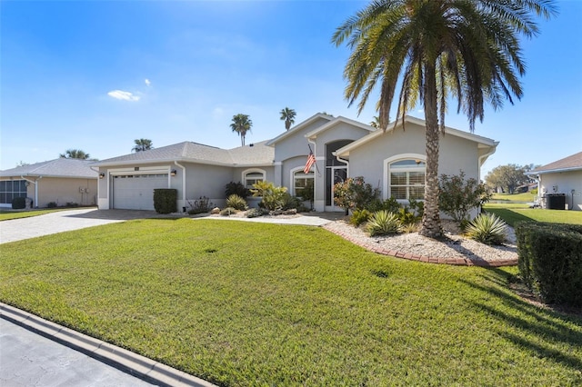 ranch-style house with a garage, decorative driveway, a front lawn, and stucco siding