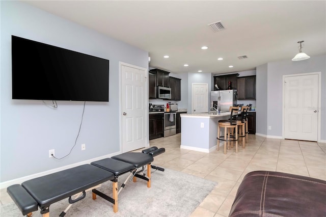 interior space with light tile patterned floors, baseboards, visible vents, and recessed lighting