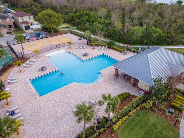 view of pool with a patio and fence