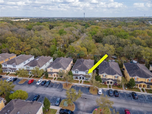 bird's eye view with a residential view and a wooded view