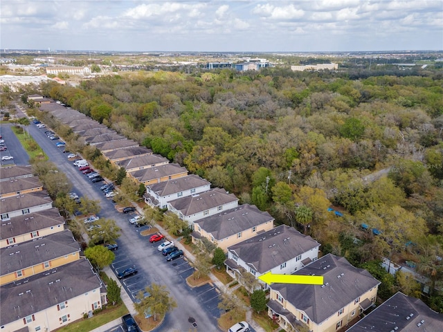 aerial view featuring a residential view and a view of trees