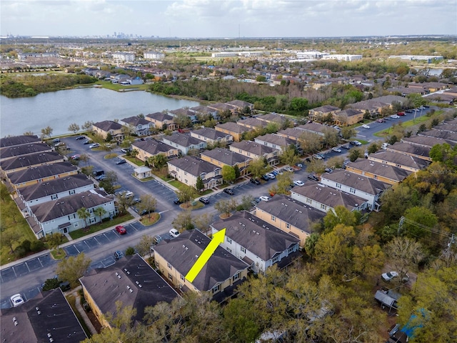 bird's eye view featuring a residential view and a water view