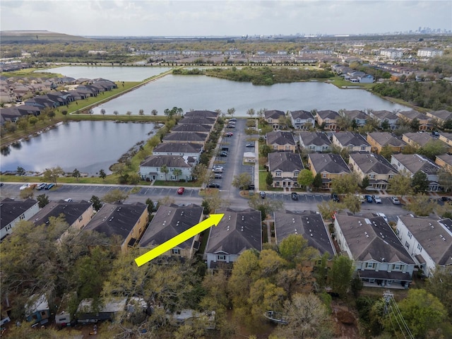 bird's eye view with a water view and a residential view