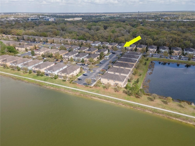 aerial view with a water view and a residential view