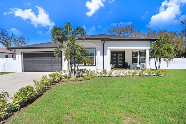 view of front facade featuring a garage, concrete driveway, fence, a front lawn, and stucco siding