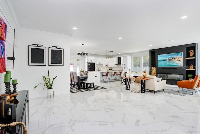 living room featuring marble finish floor, plenty of natural light, crown molding, and recessed lighting