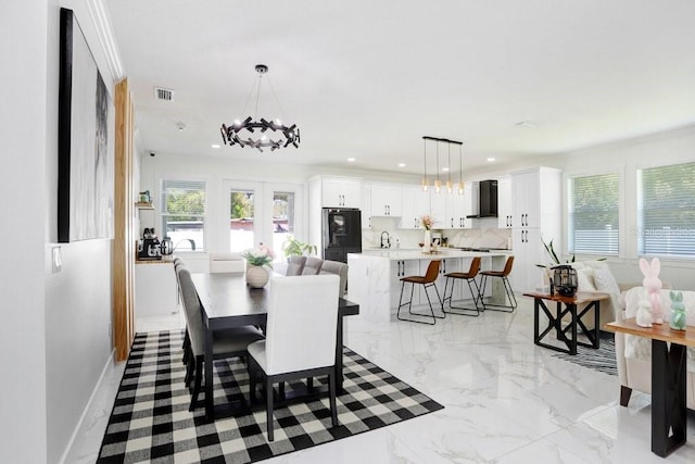 dining room with baseboards, marble finish floor, french doors, a notable chandelier, and recessed lighting