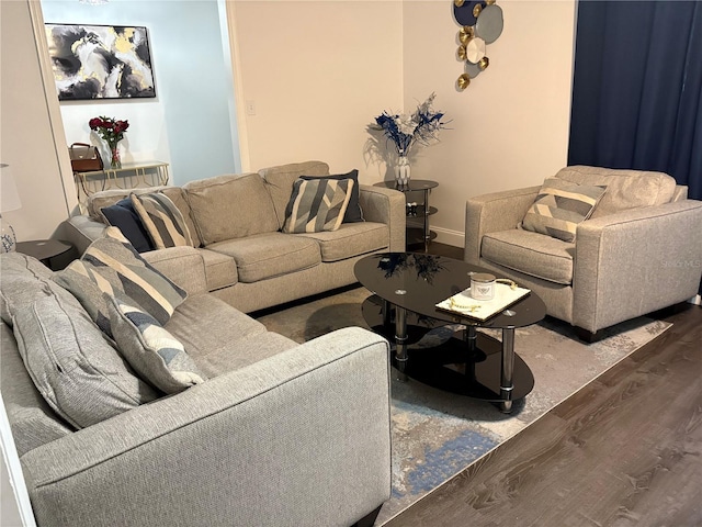 living room with wood finished floors and baseboards