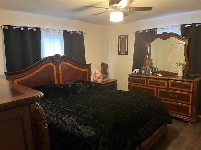 bedroom with ceiling fan and wood finished floors