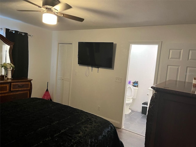 bedroom featuring a ceiling fan, a closet, and connected bathroom