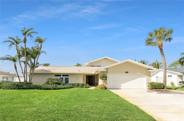 single story home featuring a garage, a front yard, and driveway