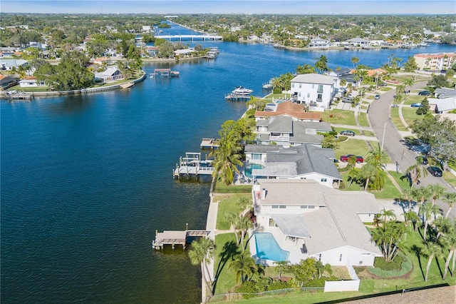 drone / aerial view featuring a water view and a residential view