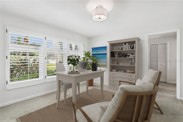 office area with baseboards and light colored carpet