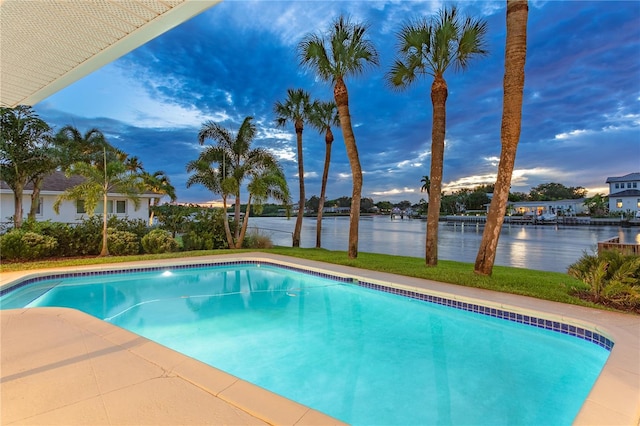 outdoor pool featuring a water view