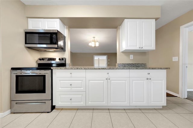 kitchen featuring white cabinetry, light tile patterned floors, baseboards, and appliances with stainless steel finishes