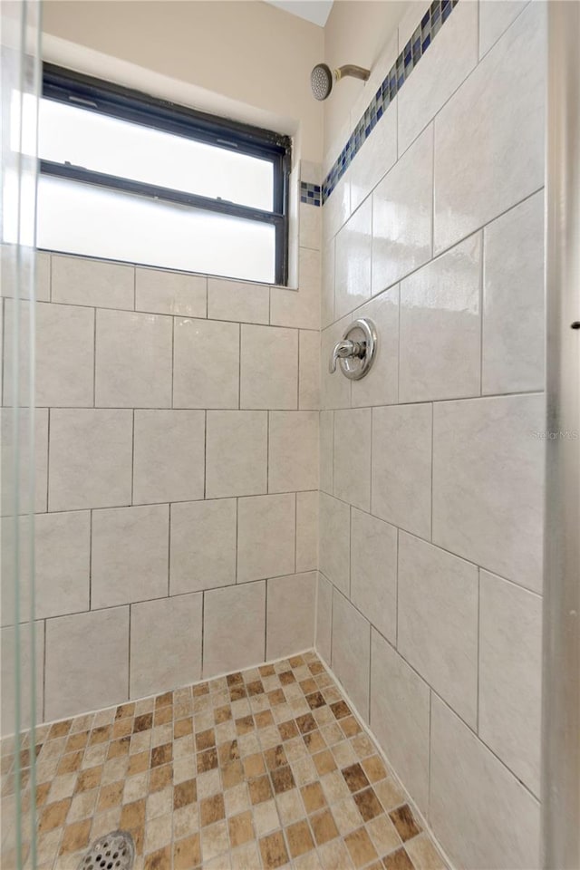 bathroom with tiled shower