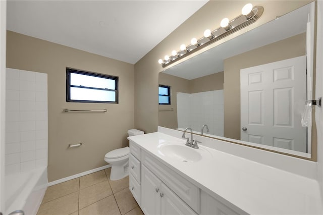 bathroom with baseboards, toilet, vanity, and tile patterned flooring