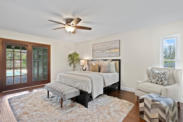 bedroom with dark wood-style floors, ceiling fan, french doors, and baseboards