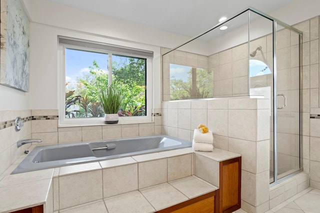 full bath with tile patterned flooring, a shower stall, a bath, and recessed lighting