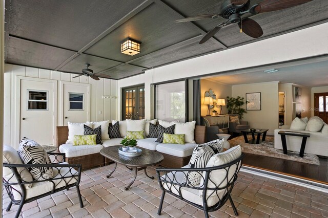 view of patio / terrace featuring ceiling fan and an outdoor living space