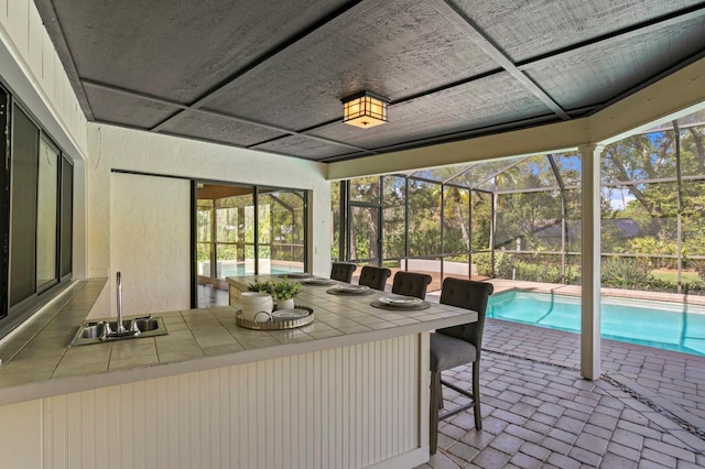 sunroom with a sink