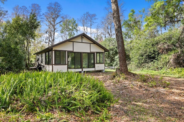 exterior space featuring a sunroom