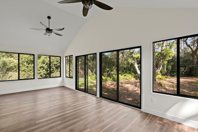 unfurnished sunroom featuring a ceiling fan and lofted ceiling