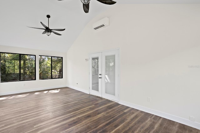 unfurnished room featuring a wall unit AC, dark wood finished floors, a ceiling fan, and french doors