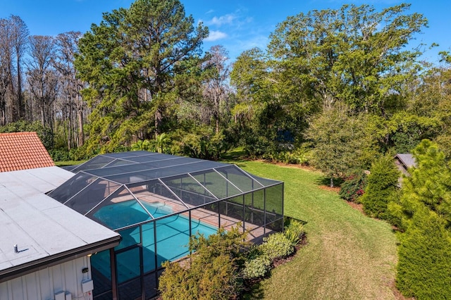 exterior space featuring an outdoor pool, a patio, and a yard