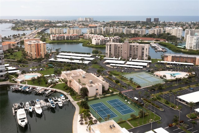 drone / aerial view featuring a water view and a view of city