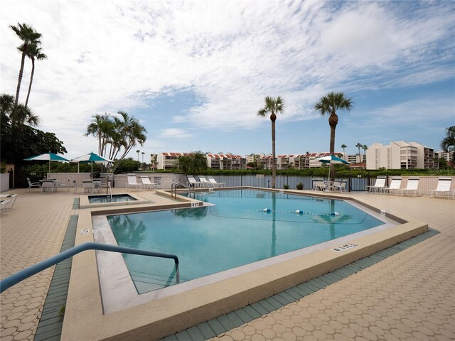 pool with a patio area