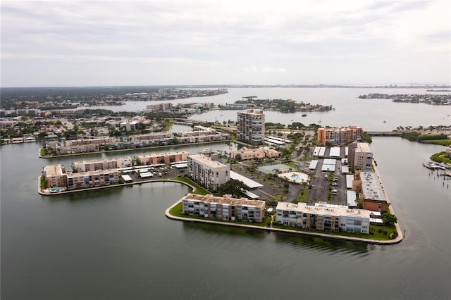 bird's eye view featuring a water view and a city view