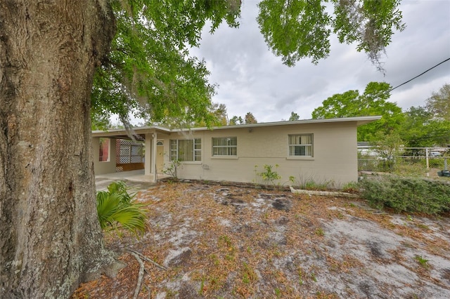 rear view of house with fence